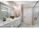 Bathroom featuring double sink vanity, large mirror, and a glass-enclosed shower at 1432 Ardmore Dr # 341, Sherrills Ford, NC 28673