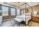 Primary bedroom suite featuring a four-poster bed, large windows, and stylish decor at 1432 Ardmore Dr # 341, Sherrills Ford, NC 28673