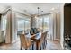 Bright dining room with a sliding glass door to outside, a modern chandelier, and seating for six at 1432 Ardmore Dr # 341, Sherrills Ford, NC 28673