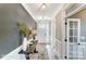 Inviting entryway with a wooden table, vase, and a view of the front door and a glass-paneled door at 1432 Ardmore Dr # 341, Sherrills Ford, NC 28673