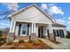 Charming home with stone accents, covered porch, manicured landscaping, and an attached two car garage at 1432 Ardmore Dr # 341, Sherrills Ford, NC 28673