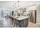 Bright kitchen featuring white cabinets, stainless steel appliances, a large island with bar seating, and an adjacent dining area at 1432 Ardmore Dr # 341, Sherrills Ford, NC 28673
