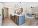 Open-concept kitchen with center island, stainless steel dishwasher, and seamless flow to the living area at 1432 Ardmore Dr # 341, Sherrills Ford, NC 28673