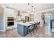 Well-lit kitchen with white cabinets, stainless steel appliances, center island with seating, and modern pendant lights at 1432 Ardmore Dr # 341, Sherrills Ford, NC 28673