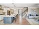 Open concept kitchen leading to living area, featuring a staircase, sofa, and large center island at 1432 Ardmore Dr # 341, Sherrills Ford, NC 28673