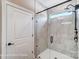 Modern glass shower enclosure, with tile surround and brushed metal shower head at 1432 Ardmore Dr # 341, Sherrills Ford, NC 28673