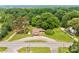 Birds-eye view of a cozy single-story home on a spacious lot, surrounded by lush greenery and neighboring houses at 1529 Stony Point Rd, Shelby, NC 28150