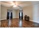 Spacious living room featuring laminate wood floors and a ceiling fan with lighting at 1529 Stony Point Rd, Shelby, NC 28150