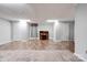 Neutral living room with hardwood floors, grey carpet, wooden writing desk, and plenty of natural light at 1529 Stony Point Rd, Shelby, NC 28150