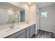 Bathroom with double sink vanity, a large mirror, and a glass-enclosed shower at 1543 Cottage Creek Dr, Bessemer City, NC 28016