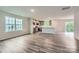 Spacious living room with modern flooring, lots of light, and an open layout to the kitchen at 1543 Cottage Creek Dr, Bessemer City, NC 28016