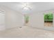 Sun-filled bedroom with views of the lush yard at 1773 Baldwin Ln, Lincolnton, NC 28092