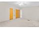 Spacious bedroom featuring plush carpet and built-in closet space for maximum storage at 1773 Baldwin Ln, Lincolnton, NC 28092
