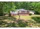 Single-story home with inviting porch and brick foundation set on a grassy lawn at 1773 Baldwin Ln, Lincolnton, NC 28092