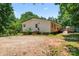 Side view of single-story home with accessible ramp and gravel driveway at 1773 Baldwin Ln, Lincolnton, NC 28092
