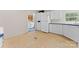 Functional kitchen with white cabinetry, including access to the laundry area at 1773 Baldwin Ln, Lincolnton, NC 28092