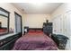 Cozy bedroom with patterned bedding and dark wood furniture at 1825 Stroud Park Ct, Charlotte, NC 28206