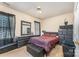 Bedroom with leopard print bedding and dark wood furniture at 1825 Stroud Park Ct, Charlotte, NC 28206