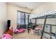 A bedroom featuring a loft bed with a play area below and natural light through a window at 1825 Stroud Park Ct, Charlotte, NC 28206