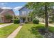 Charming two-story home featuring a cozy front porch and well-maintained landscaping at 1825 Stroud Park Ct, Charlotte, NC 28206