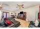 Open-concept living room with a large sectional sofa, fireplace, and view of dining area at 1825 Stroud Park Ct, Charlotte, NC 28206