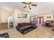 Open living room featuring a comfortable sectional, a staircase, and adjacent dining area at 1825 Stroud Park Ct, Charlotte, NC 28206