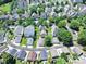 An aerial view of a charming neighborhood with mature trees and well-manicured lawns, presenting an inviting community atmosphere at 187 Water Oak Dr, Mooresville, NC 28117