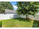 Private backyard with a well-manicured lawn and white fence is perfect for outdoor enjoyment at 187 Water Oak Dr, Mooresville, NC 28117