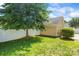 Spacious backyard with a lush green lawn and a white fence offers privacy and room for outdoor activities at 187 Water Oak Dr, Mooresville, NC 28117