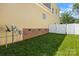 Enclosed backyard with a lush green lawn and a white fence provides a safe and private outdoor space at 187 Water Oak Dr, Mooresville, NC 28117