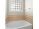 Cozy bathroom featuring a soaking tub and window for natural light at 187 Water Oak Dr, Mooresville, NC 28117