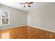 Spacious bedroom featuring ceiling fan, hardwood floors and lots of natural light at 187 Water Oak Dr, Mooresville, NC 28117