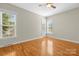 Bedroom featuring ceiling fan, hardwood floors and lots of natural light at 187 Water Oak Dr, Mooresville, NC 28117