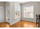Bright breakfast nook with hardwood floors, large windows, and access to outdoor space at 187 Water Oak Dr, Mooresville, NC 28117