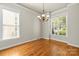 Charming dining room with hardwood floors, chandelier, and natural light at 187 Water Oak Dr, Mooresville, NC 28117