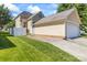 Beautiful home exterior featuring a spacious two-car garage and well-maintained lawn at 187 Water Oak Dr, Mooresville, NC 28117