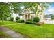 Well-maintained home with lush green lawn, enhanced by shade trees at 187 Water Oak Dr, Mooresville, NC 28117