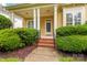 Charming front porch with white pillars and brick steps leading to the entrance at 187 Water Oak Dr, Mooresville, NC 28117