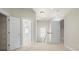 Bright hallway with neutral walls, carpet, and white trim offers access to multiple rooms at 187 Water Oak Dr, Mooresville, NC 28117