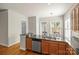 Kitchen with stainless steel appliances, granite countertops, and dark wood cabinets at 187 Water Oak Dr, Mooresville, NC 28117