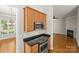 Open kitchen featuring stainless steel appliances, a granite countertop, and ample cabinet space at 187 Water Oak Dr, Mooresville, NC 28117