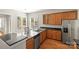 Bright kitchen with stainless steel appliances, granite countertops, and wooden cabinetry at 187 Water Oak Dr, Mooresville, NC 28117