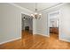 Open-concept living and dining area with beautiful hardwood floors and fireplace at 187 Water Oak Dr, Mooresville, NC 28117