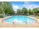Inviting community pool with lounge chairs and tables offering a relaxing atmosphere at 187 Water Oak Dr, Mooresville, NC 28117