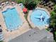 Aerial view of the community pool, with a slide and plenty of seating and lounge chairs at 187 Water Oak Dr, Mooresville, NC 28117