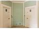 Clean community restrooms with 'Women' and 'Men' signs on painted walls at 187 Water Oak Dr, Mooresville, NC 28117