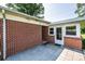 Back patio area that offers a space for relaxation and outdoor dining with ample space for entertaining and enjoying the outdoors at 2309 13Th Street Ne Dr, Hickory, NC 28601