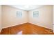 Bright bedroom with hardwood floors and two windows offering natural light at 2309 13Th Street Ne Dr, Hickory, NC 28601