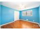 Bedroom with hardwood floors, closet space, and a window for natural light at 2309 13Th Street Ne Dr, Hickory, NC 28601