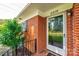 Home's charming brick facade and inviting front door create a warm and welcoming entrance at 2309 13Th Street Ne Dr, Hickory, NC 28601
